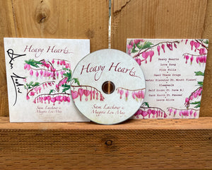 Autographed "Heavy Hearts" CD